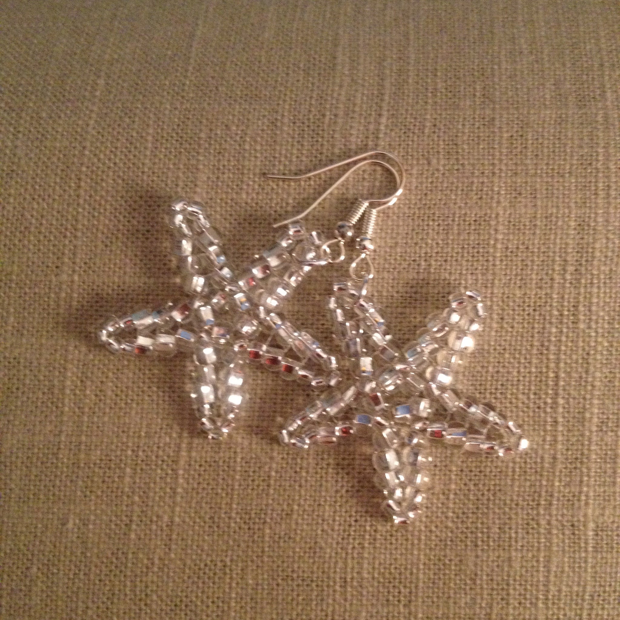 Starfish beaded handmade earrings in shiny silver clear resort cruise wear style beachy fun