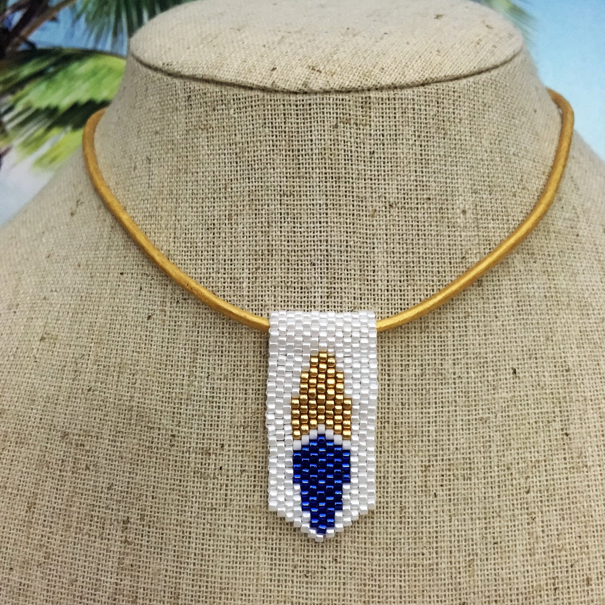 Handmade beaded mini surfboard pendant on leather cord blue white yellow gold 