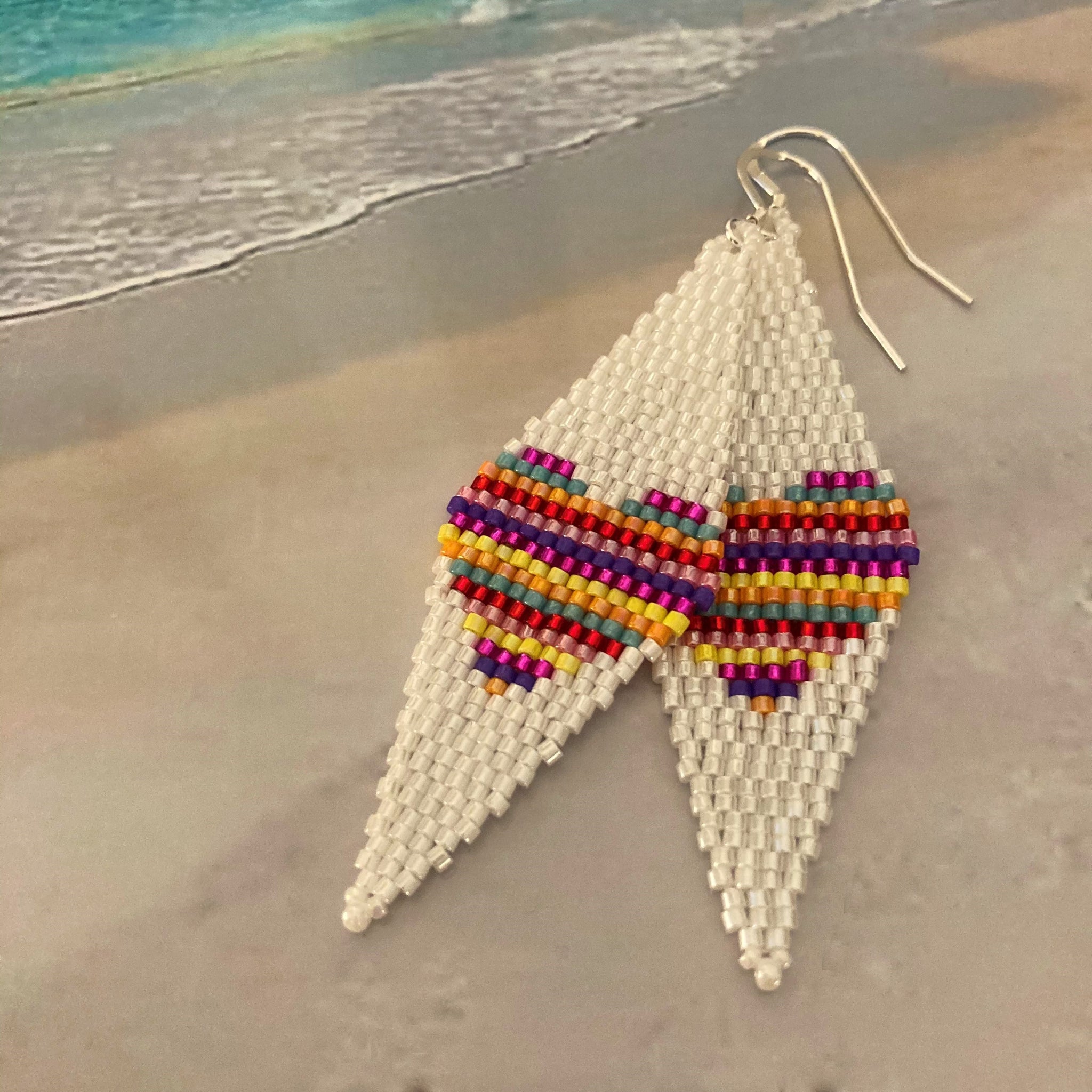 Multi color stripes fill beaded hearts earrings 14K gold filled ear wires white background beach Summer fun boho young resort playa style Beaded By The Beach swim dance cruise party ocean USA hand made vacation accessories jewelry
